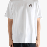 White t-shirt worn by a person, showing the t-shirt's fit