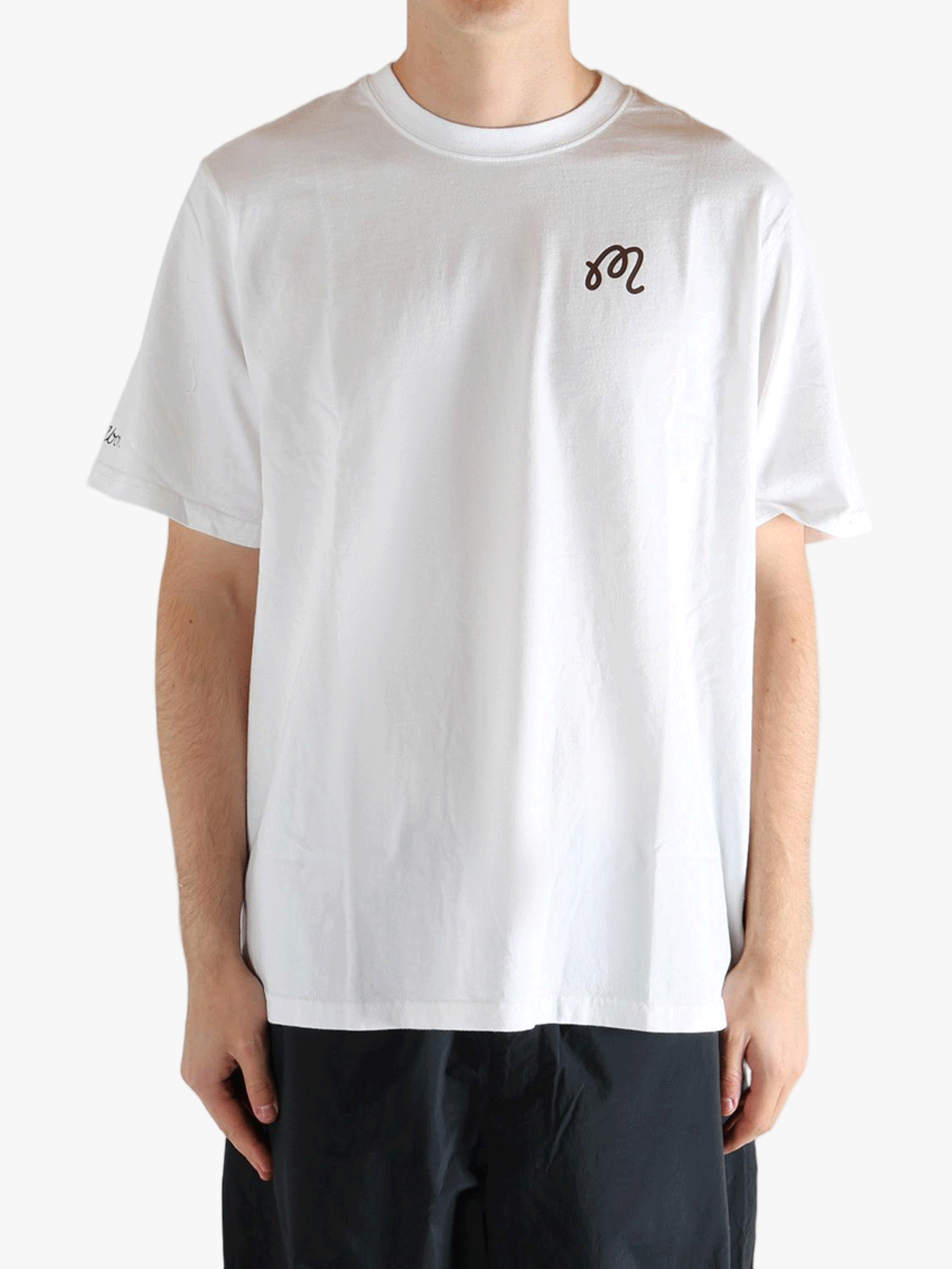 White t-shirt worn by a person, showing the t-shirt's fit