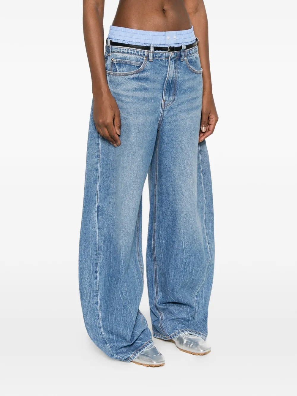 Blue jeans worn by a person, showing the jeans fit