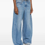 Blue jeans worn by a person, showing the jeans fit