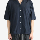 Blue shirt worn by a person, showing the shirt's fit