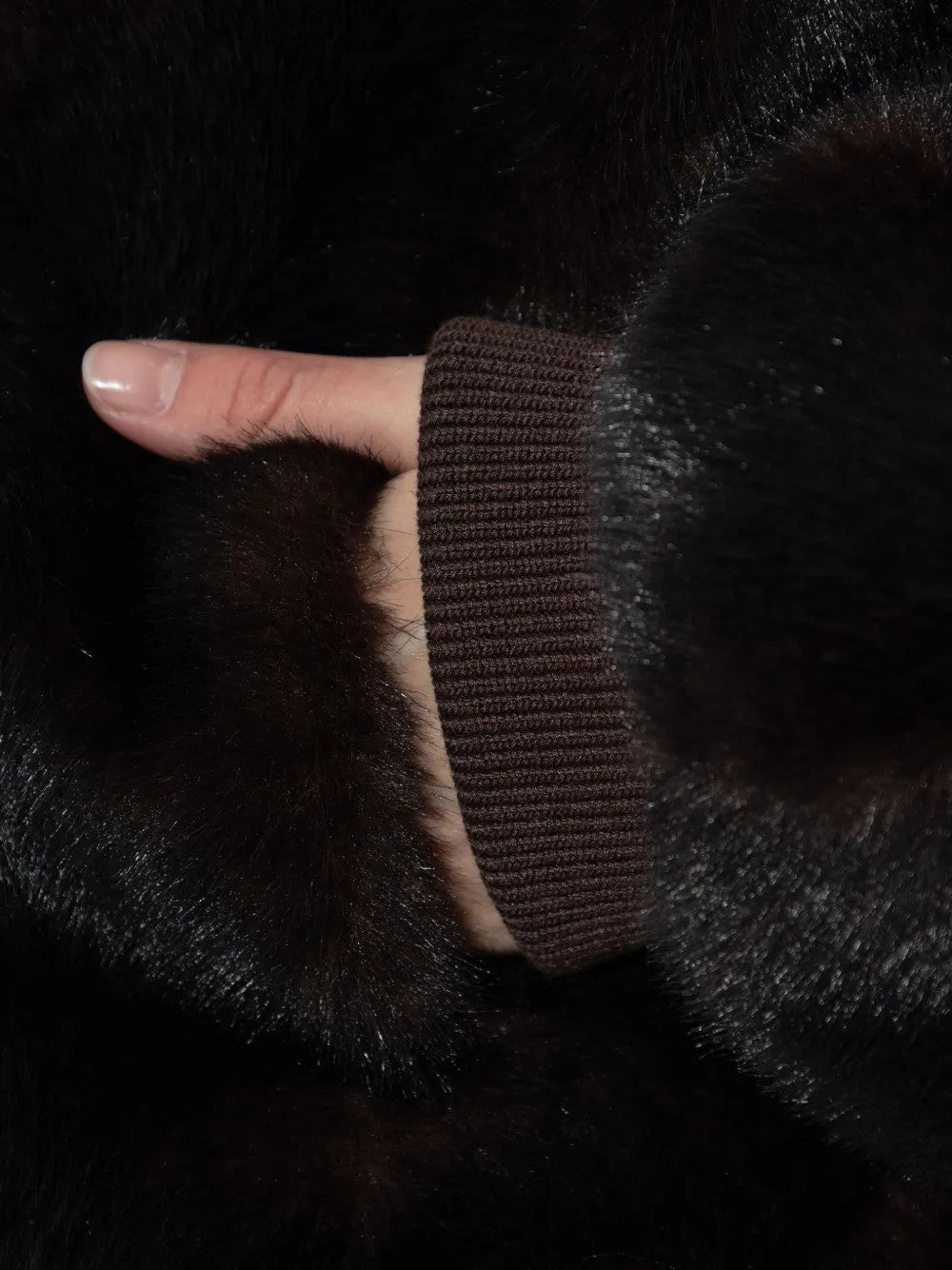 Close up of Brown jacket, showing texture of the 100% polyester fabric