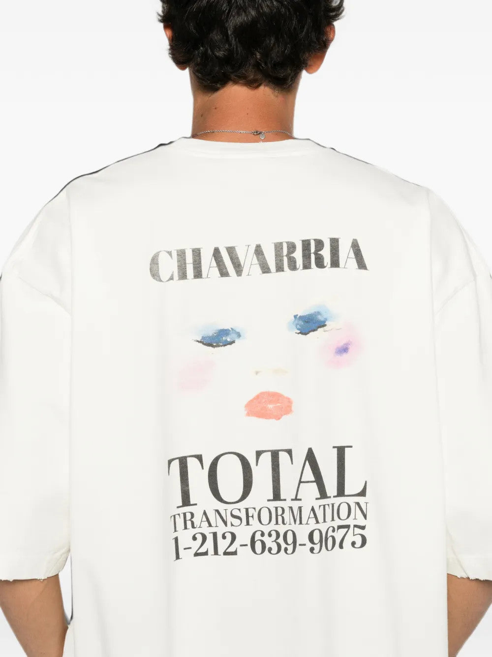 White t-shirt worn by a person, showing the t-shirt fit