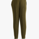 Green pants worn by a person, showing the pants' fit