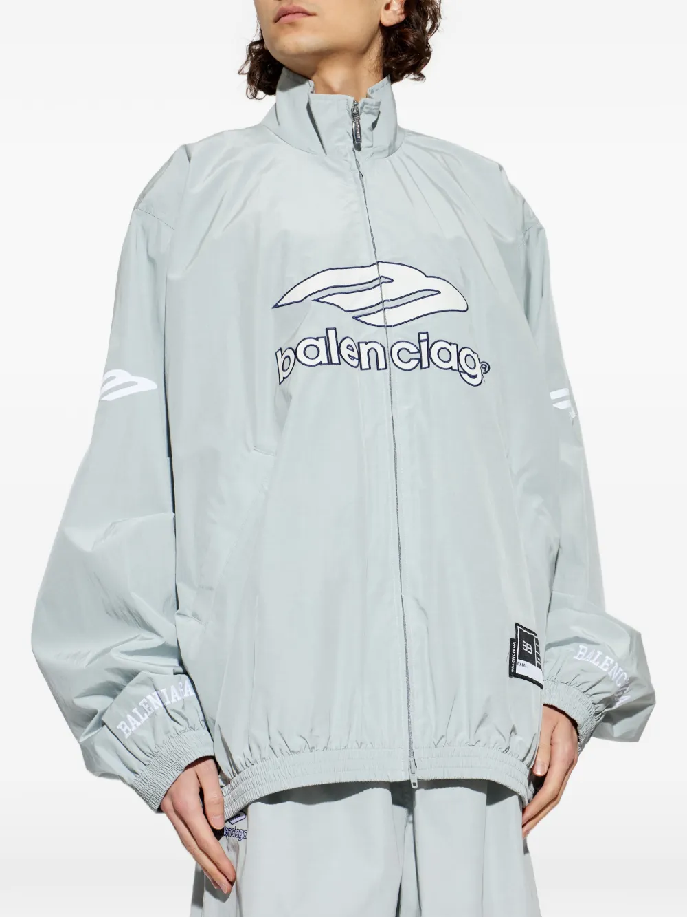 Grey jackets-coats worn by a person, showing the cotton fit