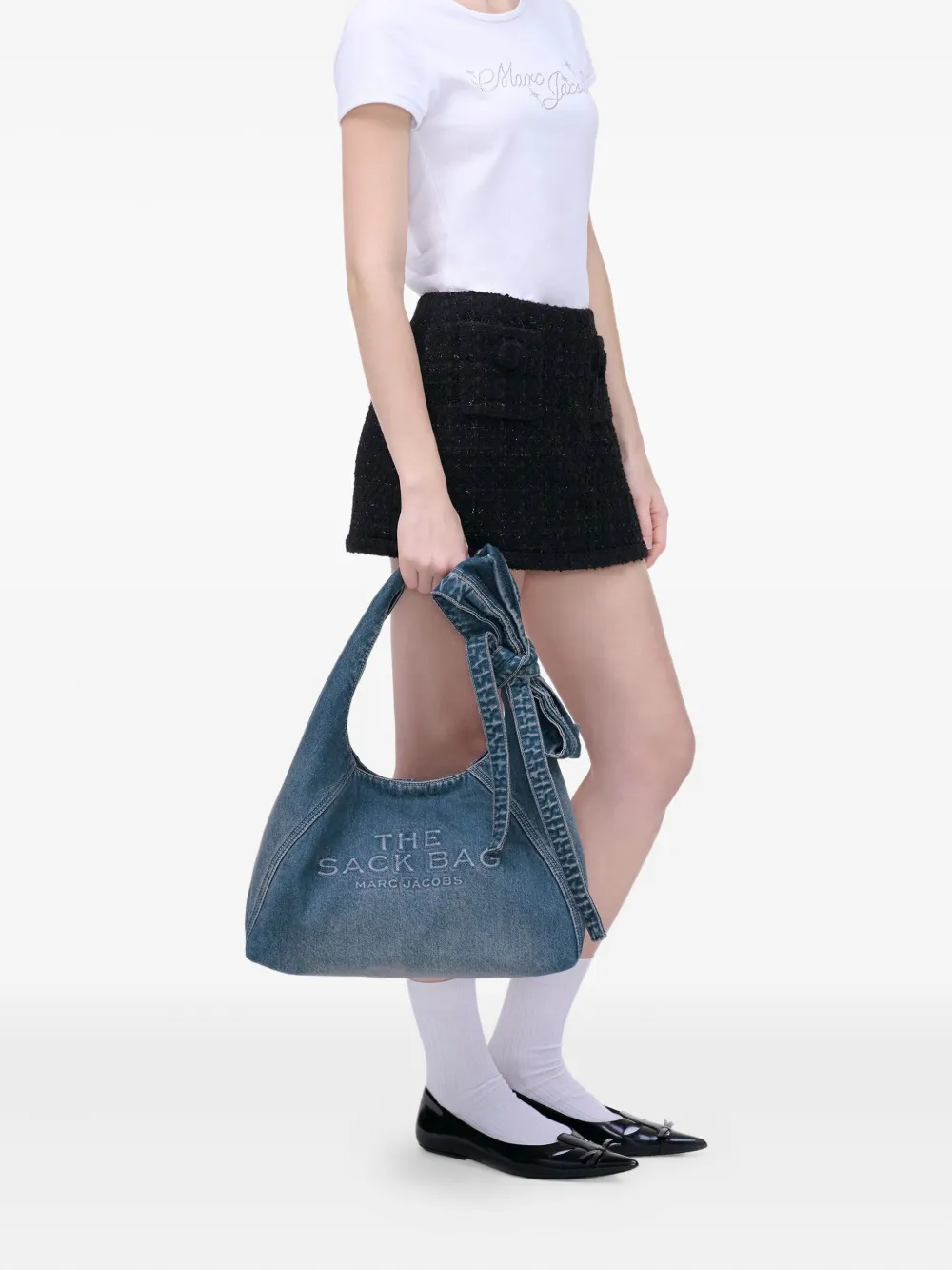 blue bags worn by a person, showing the bags fit