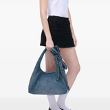 blue bags worn by a person, showing the bags fit