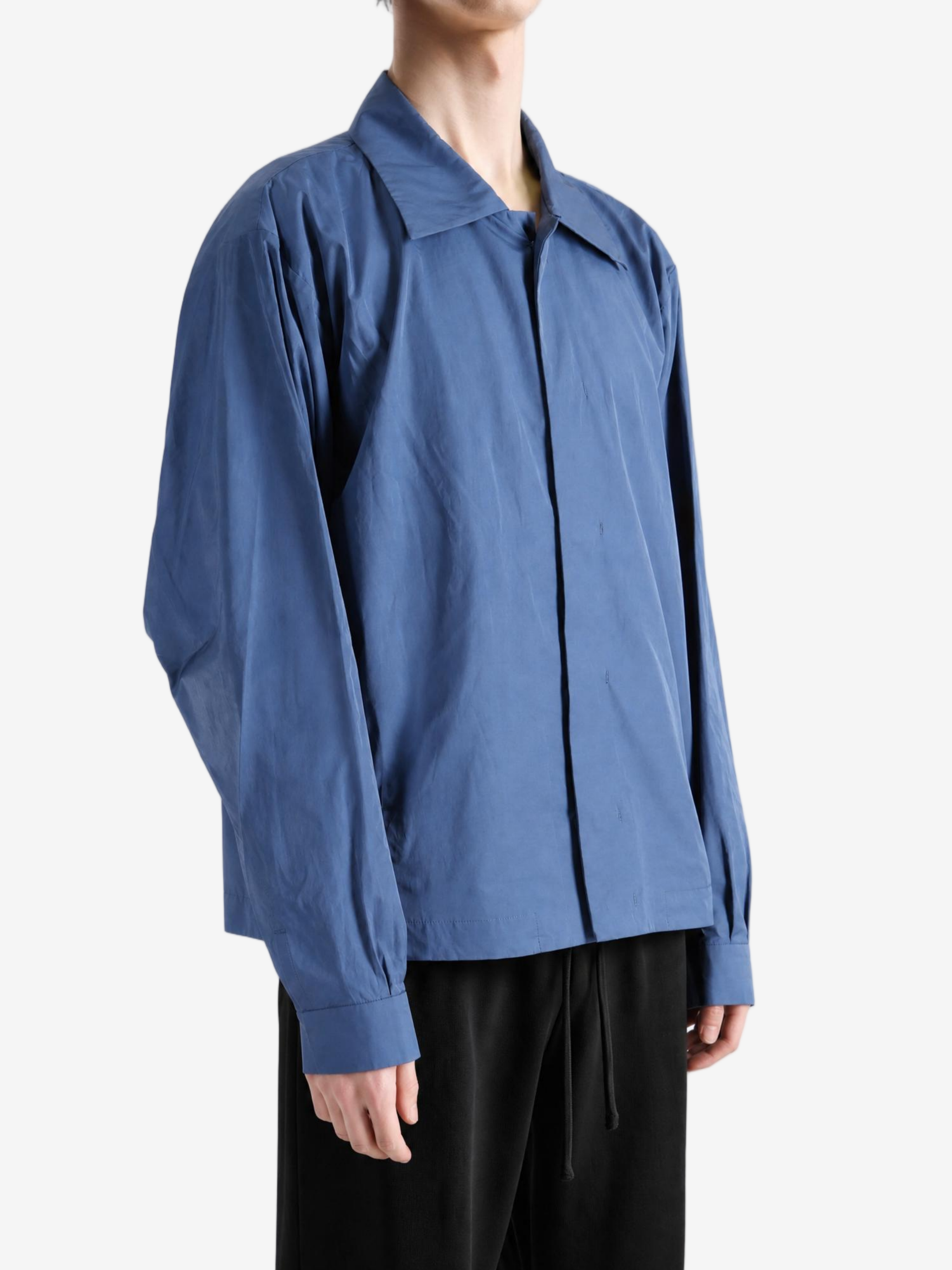 Blue jacket worn by a person, showing the jacket fit