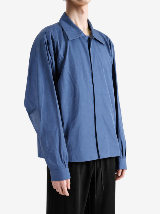 Blue jacket worn by a person, showing the jacket fit