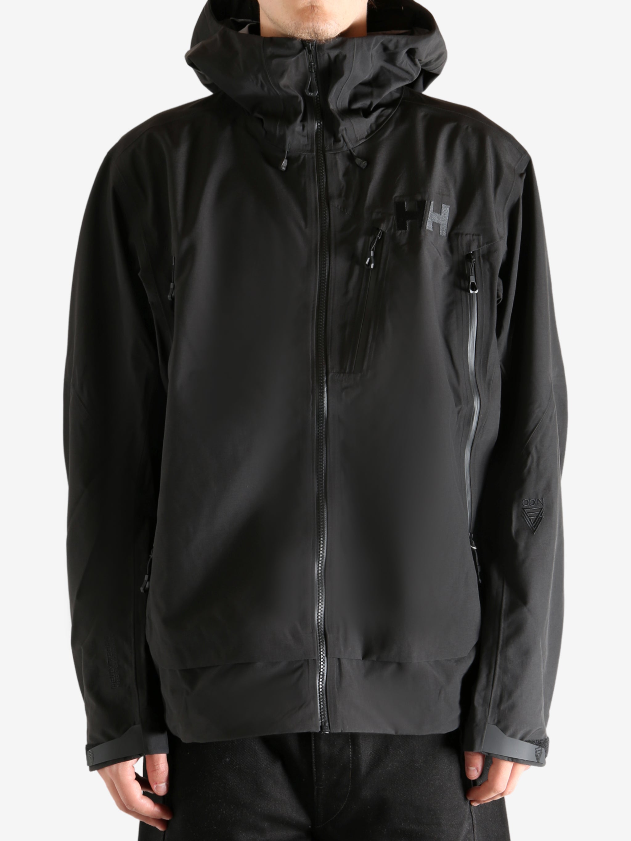 Black jacket worn by person, showing the jacket's fit