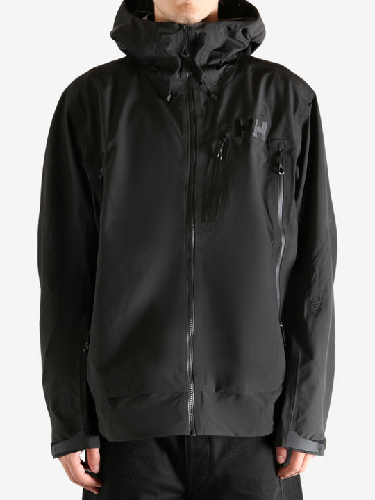 Black jacket worn by person, showing the jacket's fit