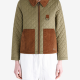 Green jacket worn by a person, showing the jacket fit