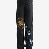 Black pants worn by a person, showing the pants' fit