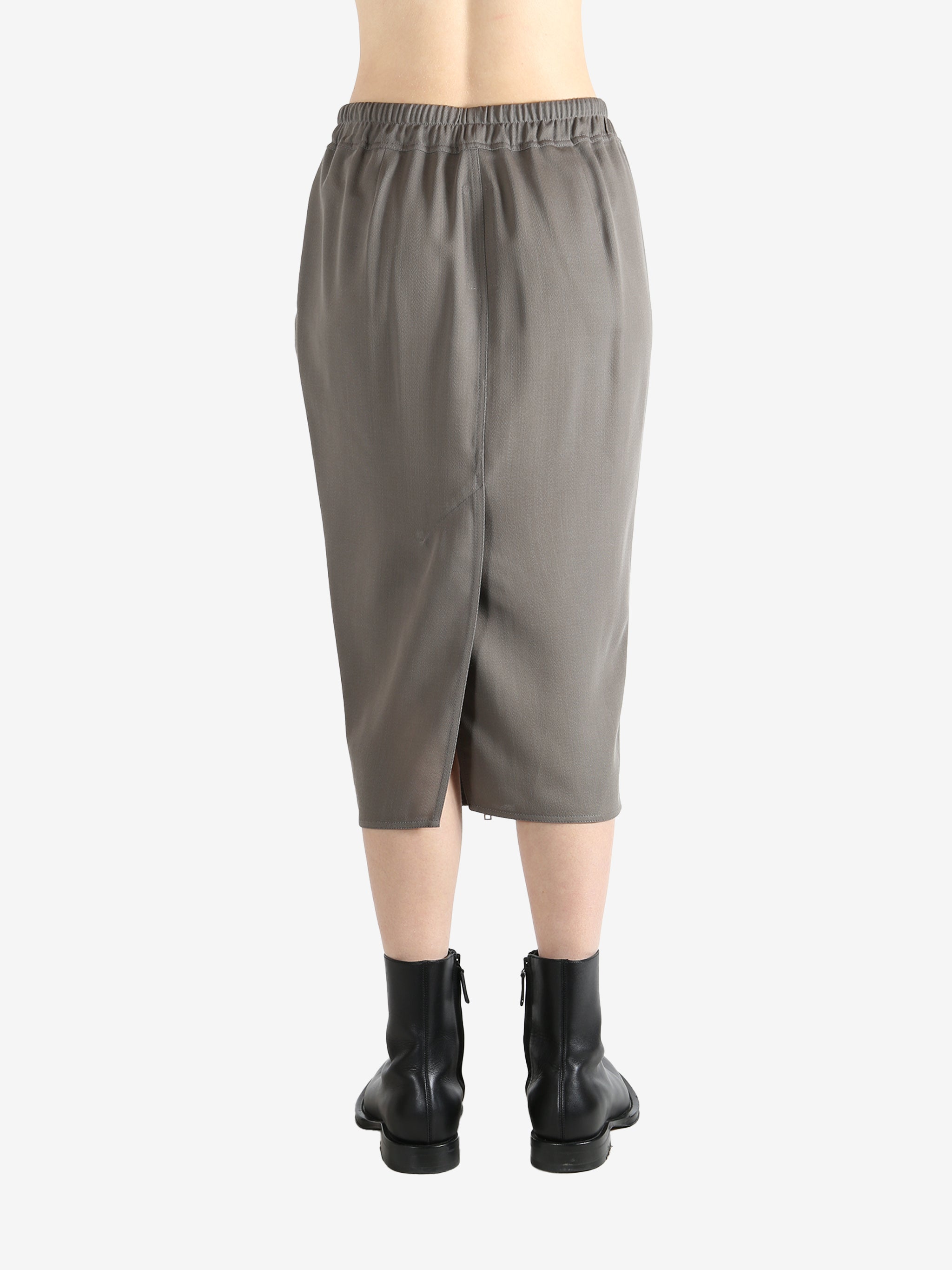 Grey skirt worn by a person, showing the skirt's fit