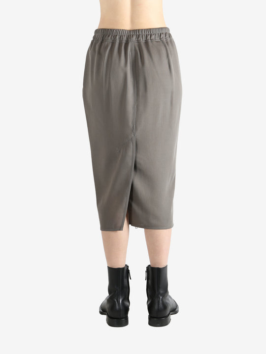 Grey skirt worn by a person, showing the skirt's fit