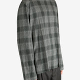 Grey shirt worn by a person, showing the shirt's fit