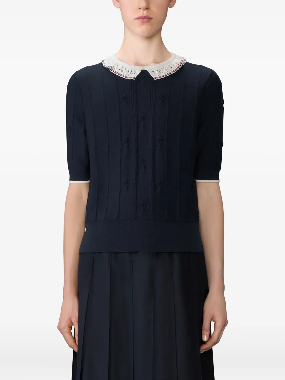 Navy top worn by a person, showing the top fit