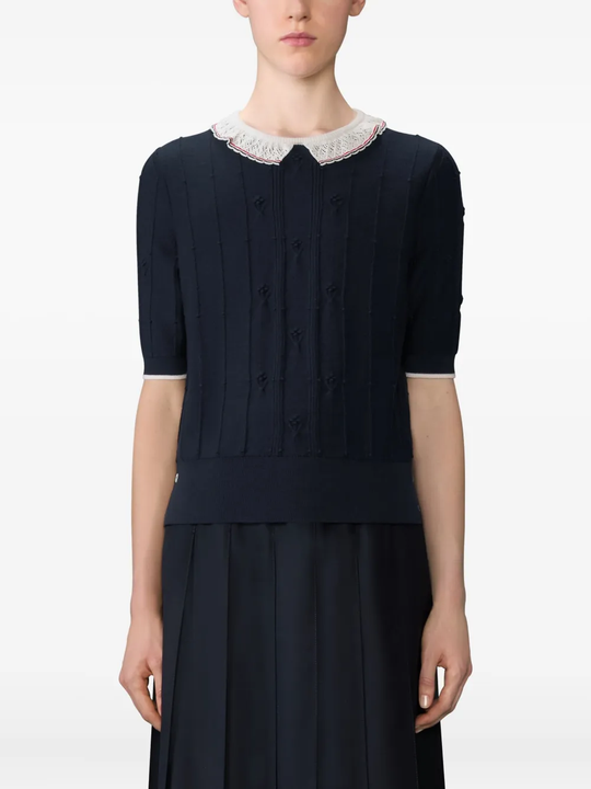 Navy top worn by a person, showing the top fit