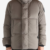 Grey jacket worn by a person, showing the jacket's fit