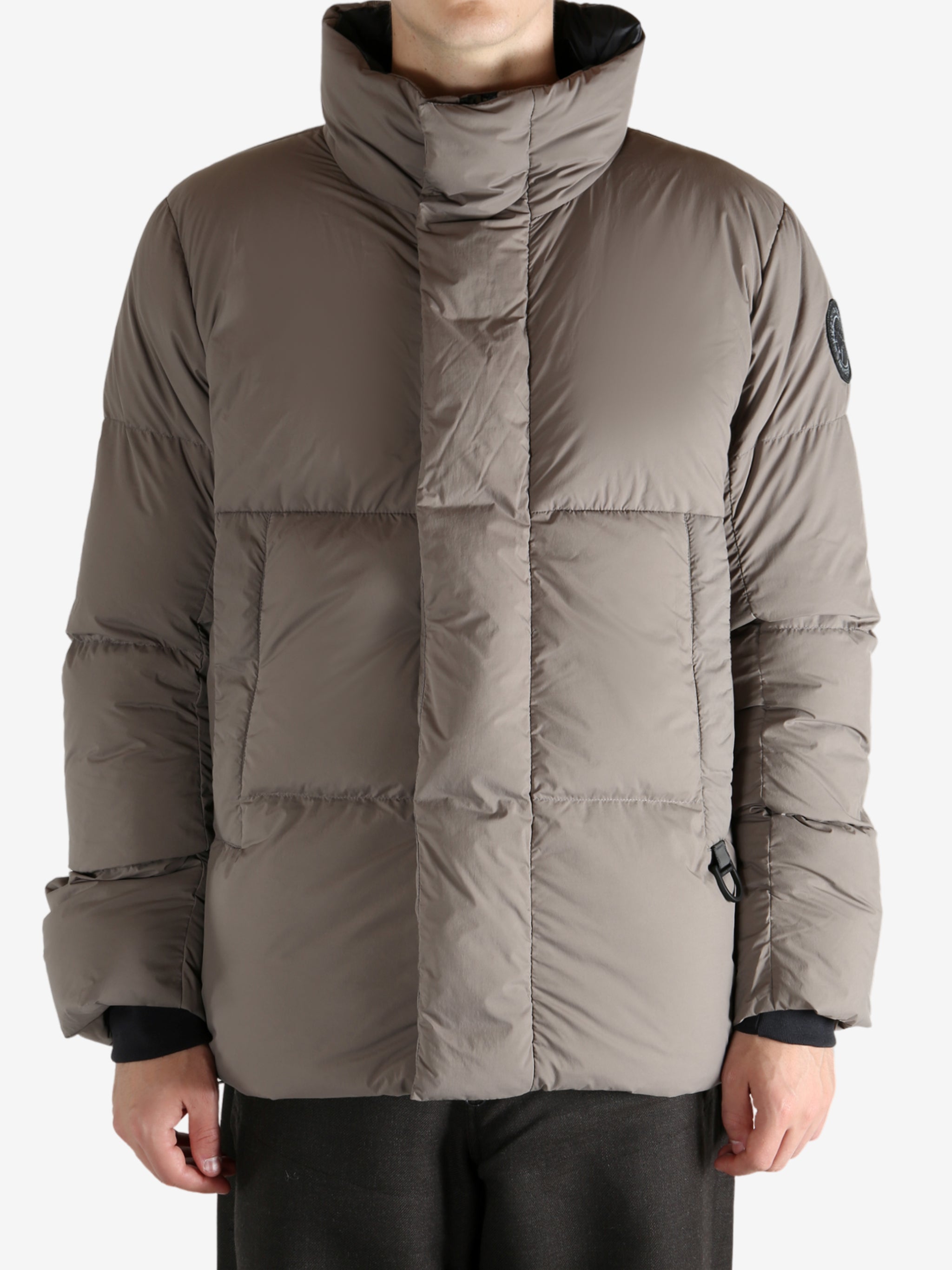 Grey jacket worn by a person, showing the jacket's fit