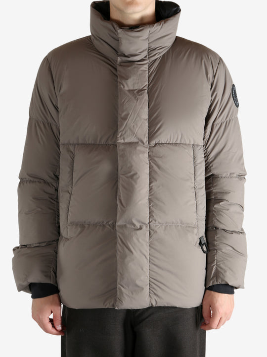 Grey jacket worn by a person, showing the jacket's fit