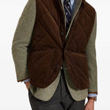 Brown jacket worn by a person, showing the jacket fit