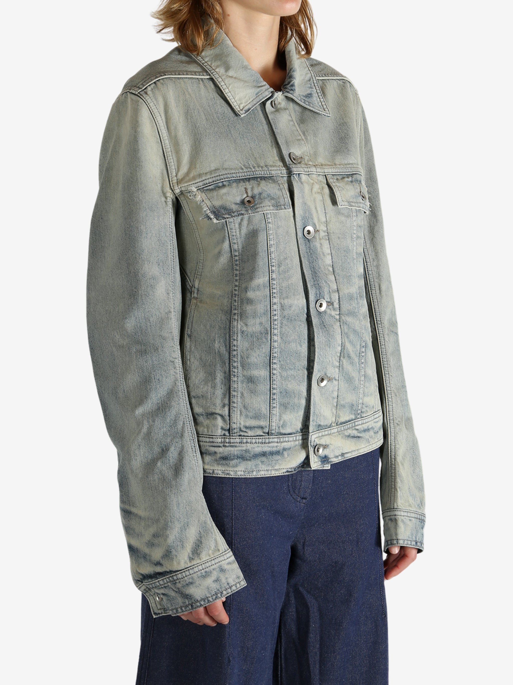 Grey jacket worn by a person, showing the jacket fit