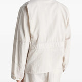 White jacket worn by a person, showing the jacket's fit