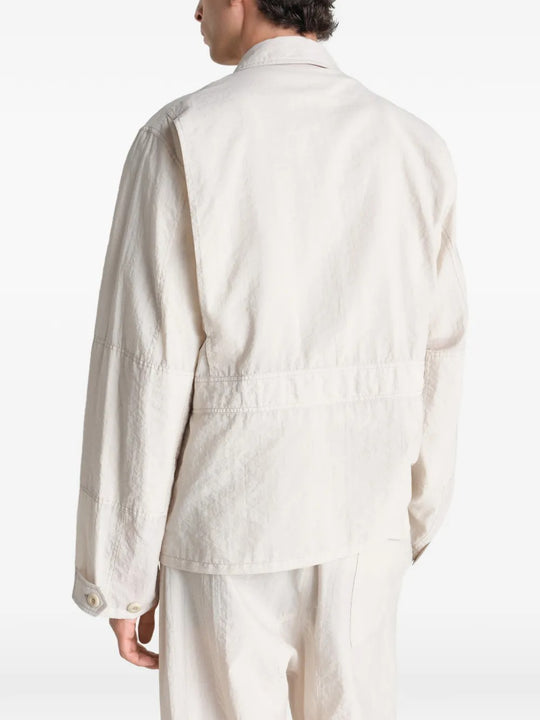 White jacket worn by a person, showing the jacket's fit