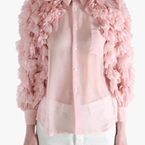 Pink blouse worn by a person, showing the blouse fit