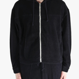 Black jackets worn by a person, showing the jackets fit