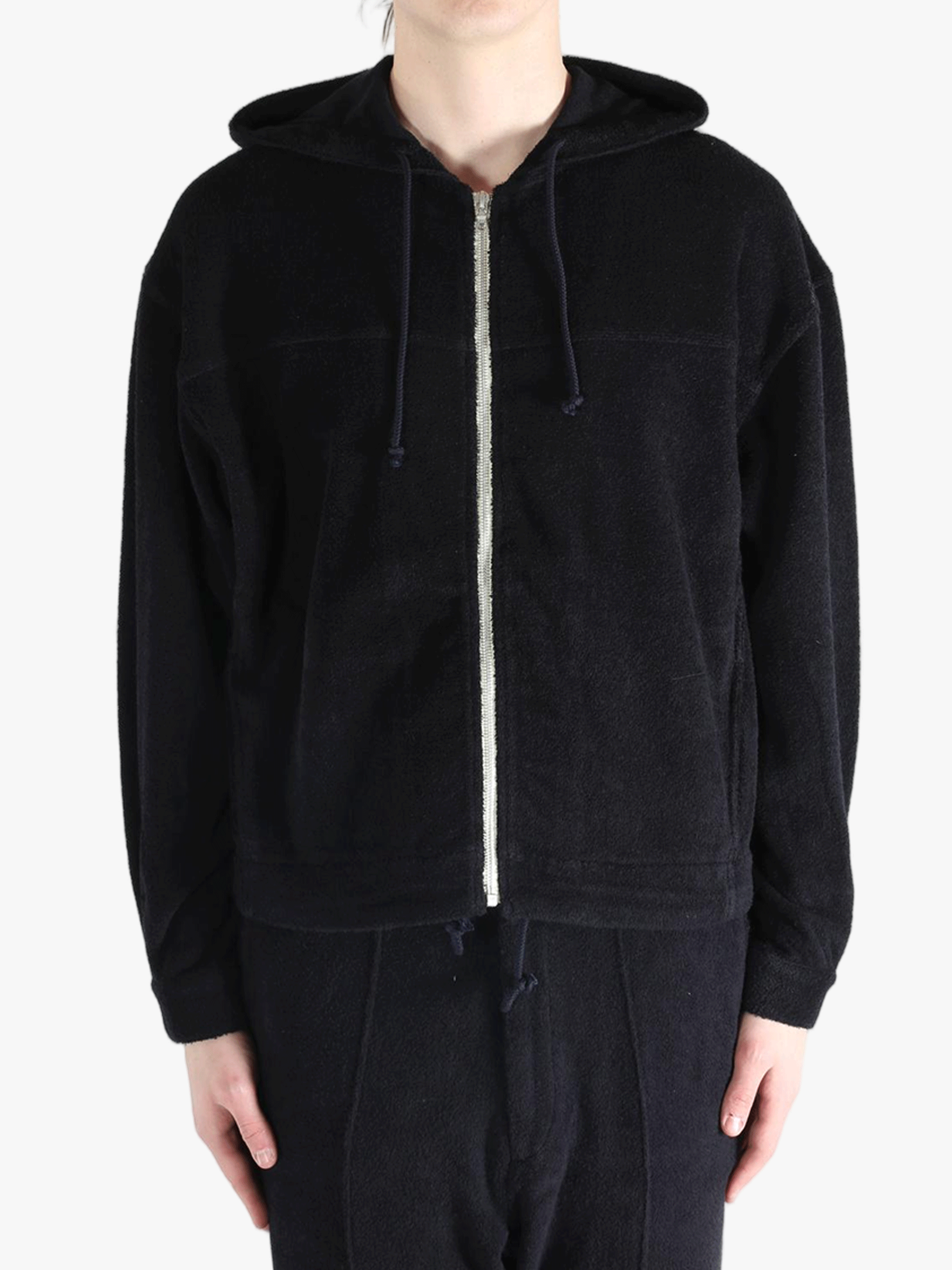 Black jackets worn by a person, showing the jackets fit