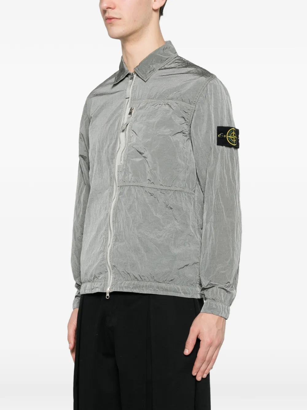 Grey coat worn by a person, showing the coat's fit