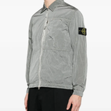 Grey coat worn by a person, showing the coat's fit