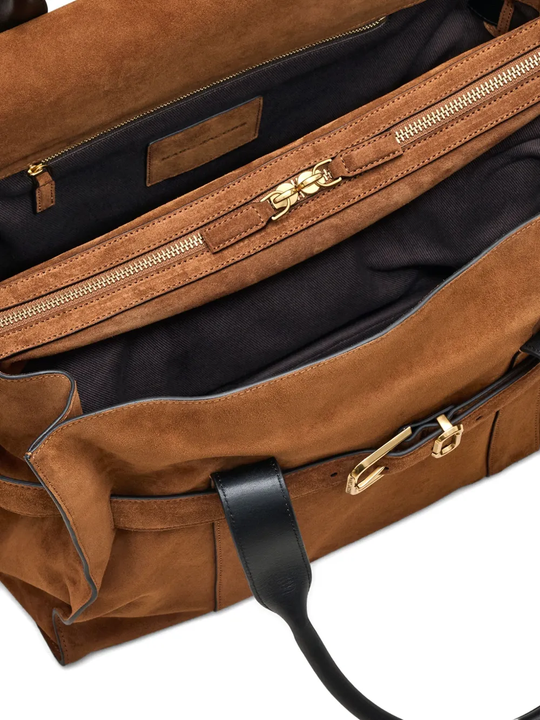 Close up of the brown bag, showing texture of the suede fabric