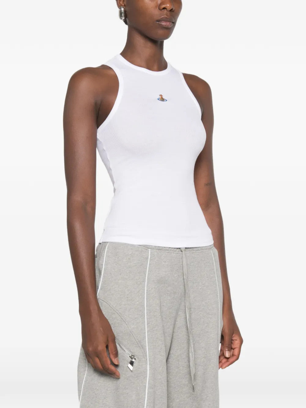 White top worn by a person, showing the top fit