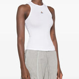 White top worn by a person, showing the top fit
