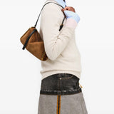 Brown bag worn by a person, showing the bag fit