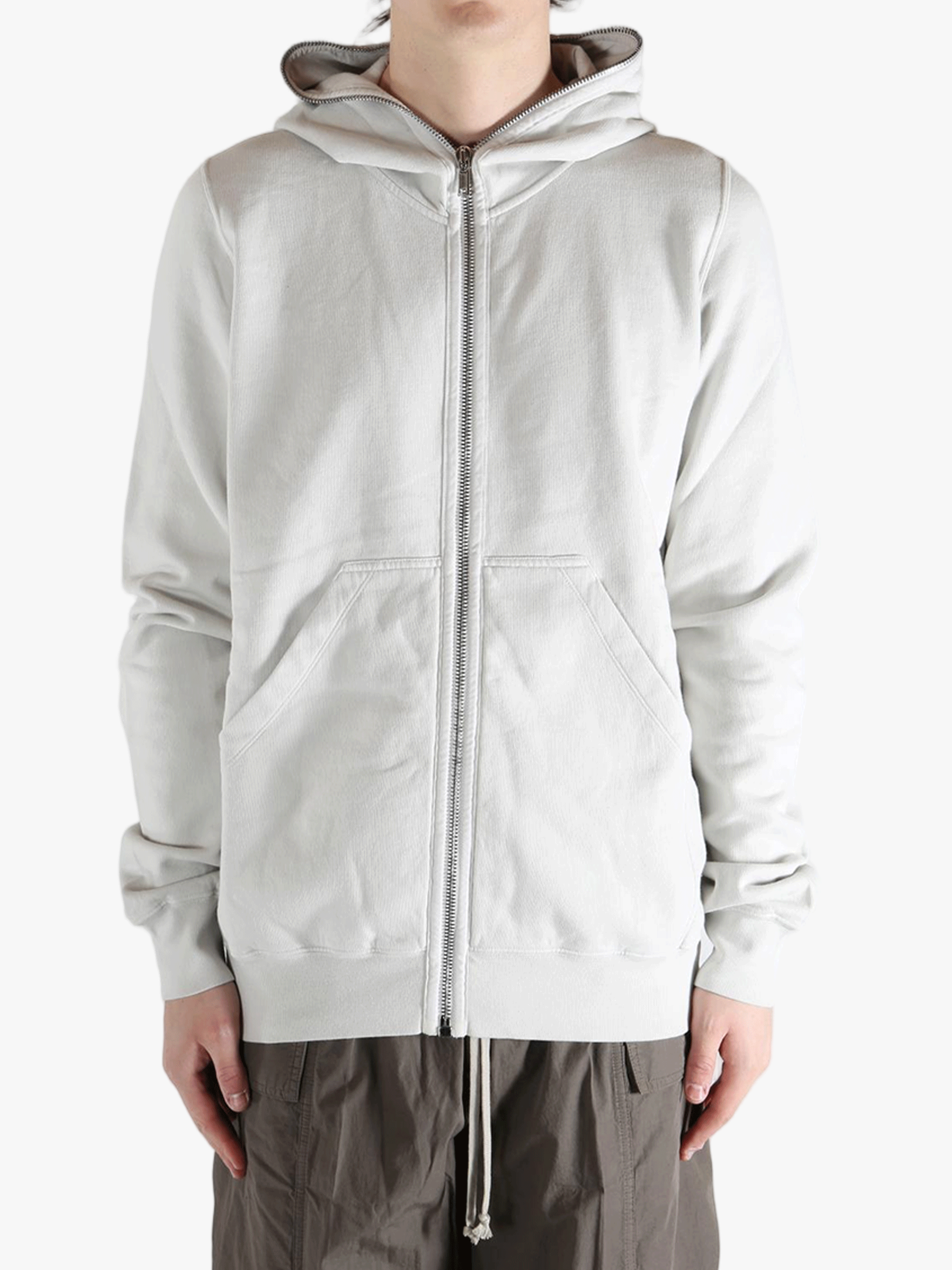 White hoodie worn by a person, showing the hoodie fit