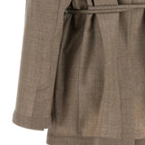 Close up of Tan jacket, showing texture of the 100% virgin wool made fabric