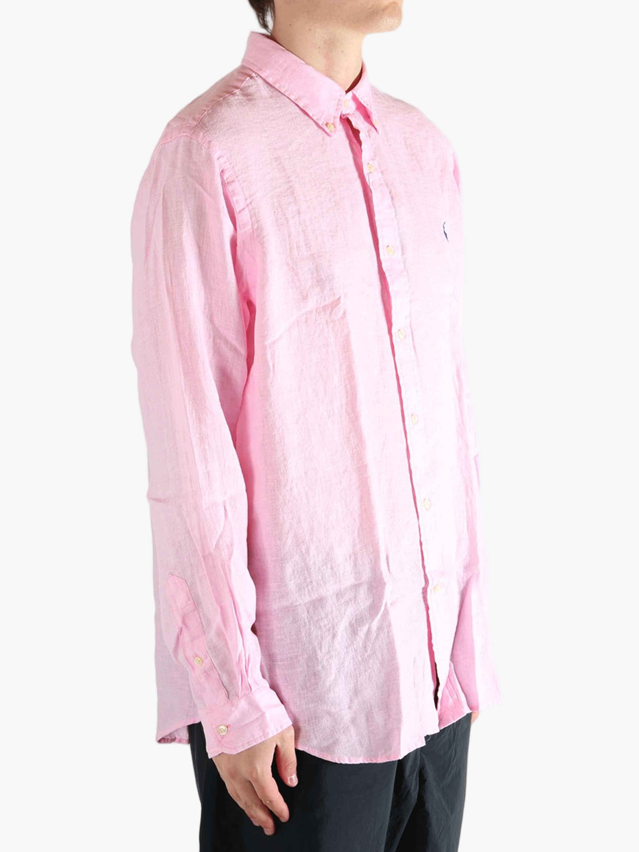 Pink shirt worn by a person, showing the shirt's fit