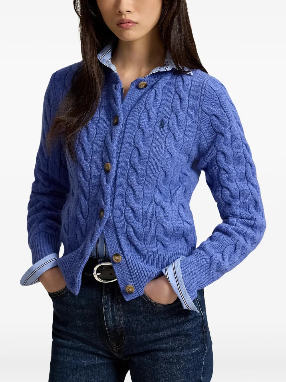 Blue knitwear worn by a person, showing the knitwear fit