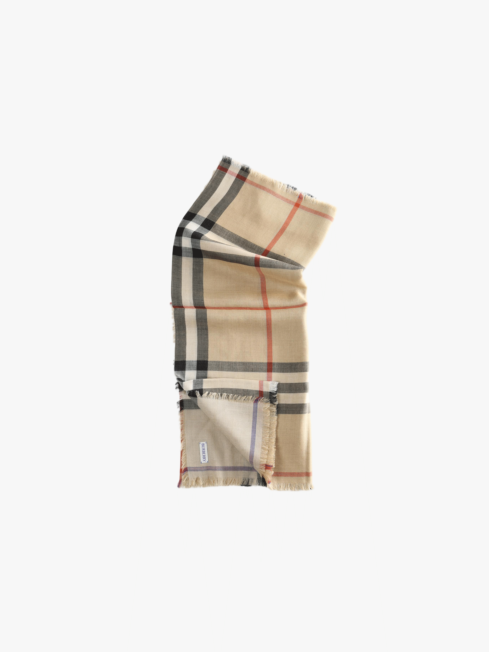 Close up of tan scarve, showing texture of the silk fabric