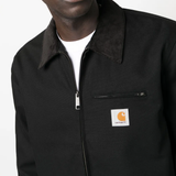 Close up of black jacket,showing texture of the cotton fabric.