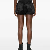 Black shorts worn by a person, showing the shorts' fit