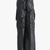 Black pants worn by a person, showing the pants's fit