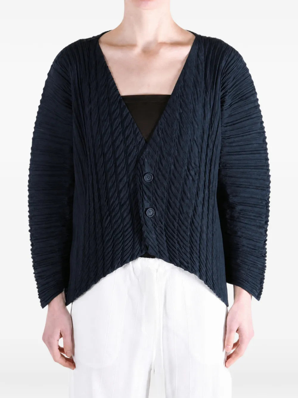 Navy knitwear worn by a person, showing the knitwear fit