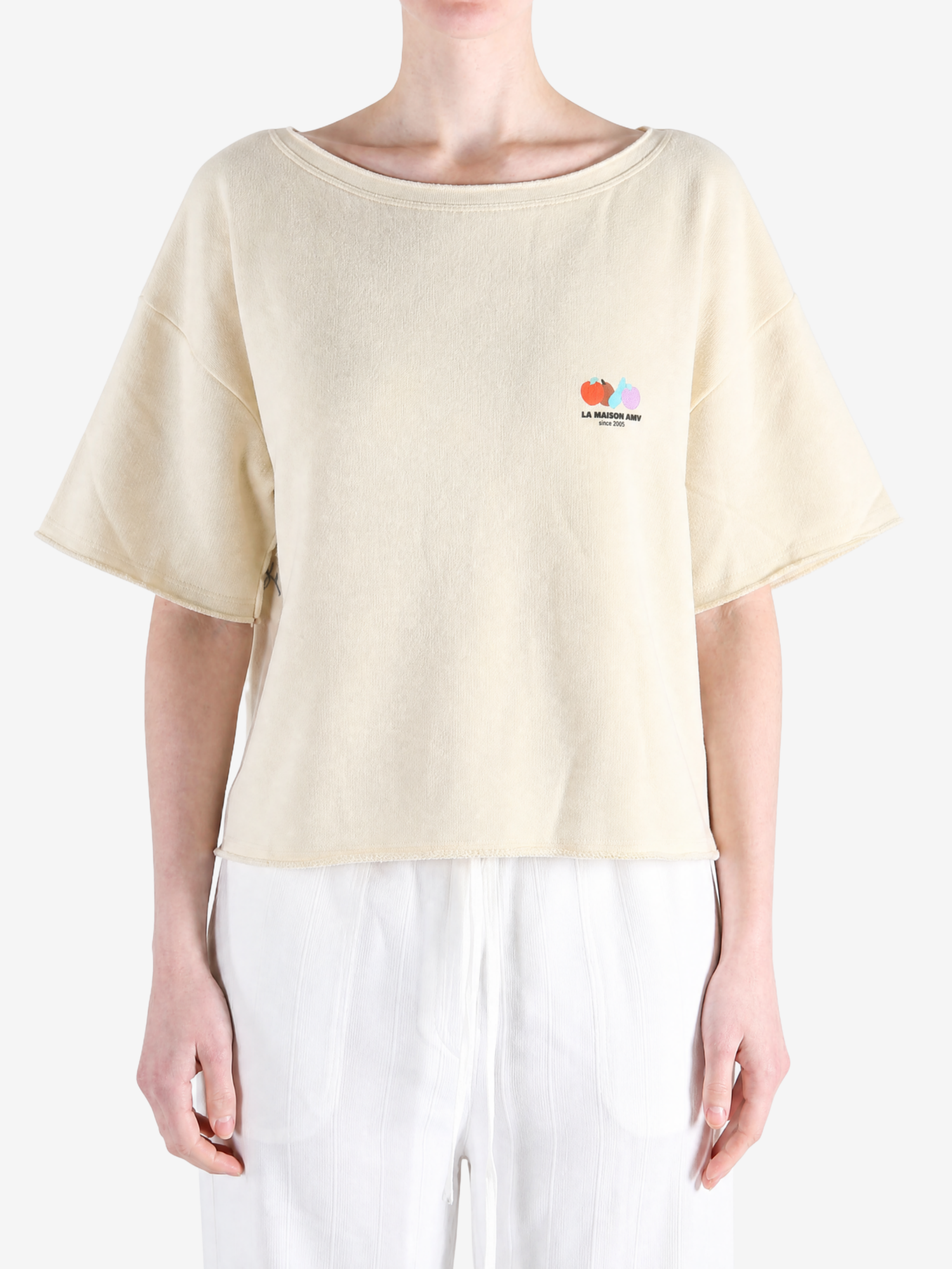 Tan t-shirt worn by a person, showing the t-shirt fit