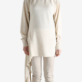 White top worn by a person, showing the top's fit