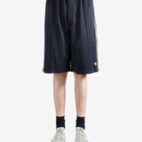 Navy shorts worn by a person, showing the shorts fit